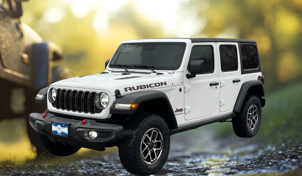 White Jeep Wrangler Rubicon 4-door SUV parked on a forest trail, featuring rugged tires and signature Jeep grille with a blurred natural background