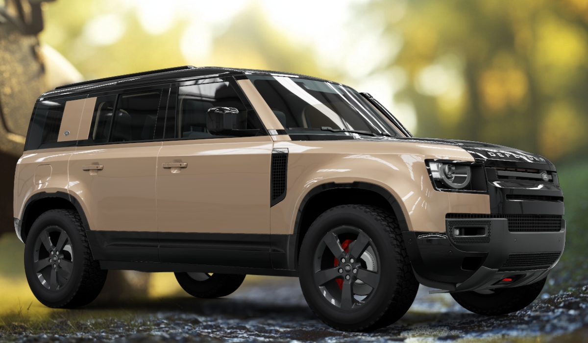 Beige Land Rover Defender 110 X SUV with black roof and red brake calipers parked on a damp forest trail under soft light