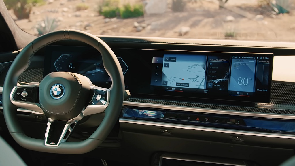 Interior of BMW 7 Series showing advanced infotainment system, steering wheel, and digital displays