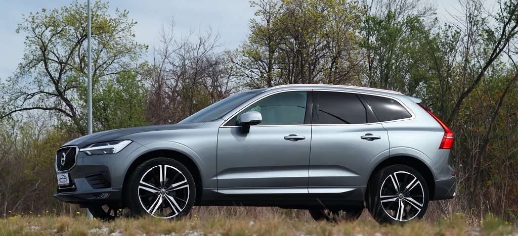 Silver Volvo XC60 SUV parked outdoors, side profile view